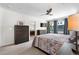 Well-appointed bedroom featuring ceiling fan, bedside tables, and adjacent ensuite at 4557 Stuart St, Denver, CO 80212