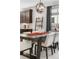 Stylish dining area featuring modern lighting, a large table, and comfortable seating at 4557 Stuart St, Denver, CO 80212