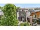 View of the modern home featuring a rooftop deck, and manicured front yard at 4557 Stuart St, Denver, CO 80212
