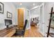 Home office with natural light, a view to other rooms, modern desk, and shelves at 4557 Stuart St, Denver, CO 80212