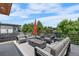 Relaxing rooftop patio featuring comfortable seating, modern fire pit, and expansive views of the surrounding area at 4557 Stuart St, Denver, CO 80212