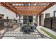 Outdoor patio featuring a pergola, dining set for six, a built-in grill, and artificial turf at 4557 Stuart St, Denver, CO 80212