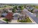 Well-maintained two-story home with manicured lawn, mature trees, and inviting curb appeal at 2194 S Braun Way, Lakewood, CO 80228