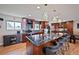 Well-designed kitchen with a large island, granite countertops, stainless steel appliances, and a dining area at 2194 S Braun Way, Lakewood, CO 80228