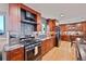 Updated kitchen featuring granite countertops, stainless steel appliances, and custom cabinetry at 2194 S Braun Way, Lakewood, CO 80228