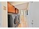 Convenient laundry room with side-by-side washer and dryer and ample storage cabinets at 2194 S Braun Way, Lakewood, CO 80228