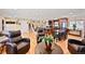 Open-concept living room and kitchen with hardwood flooring and a warm, inviting ambiance at 2194 S Braun Way, Lakewood, CO 80228