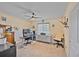 This bright home office is perfect for work from home, with a large desk, shelving, and natural light at 2194 S Braun Way, Lakewood, CO 80228