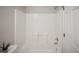 Bathroom features white tiled shower and bathtub at 3423 W Walsh Pl, Denver, CO 80219