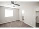 Bedroom with a ceiling fan, carpet and natural light at 3423 W Walsh Pl, Denver, CO 80219