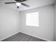 A quaint bedroom features neutral walls and carpet, complemented by a ceiling fan at 3423 W Walsh Pl, Denver, CO 80219