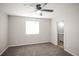 Bedroom features carpet flooring, ceiling fan and bathroom at 3423 W Walsh Pl, Denver, CO 80219