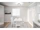 Cozy dining area features a modern table set and lots of natural light at 3423 W Walsh Pl, Denver, CO 80219