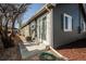 The backyard patio offers views of the yard and is conveniently located near the air conditioning unit at 3423 W Walsh Pl, Denver, CO 80219
