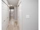 Hallway with closet space leading to a bathroom at 3423 W Walsh Pl, Denver, CO 80219