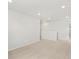 A bright bedroom with carpet and recessed lighting with access to a shared area at 553 Homestead Ave, Brighton, CO 80601