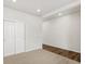 Spacious bedroom with carpet and vinyl flooring, closet and natural light at 553 Homestead Ave, Brighton, CO 80601