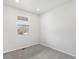 Well-lit room with carpet flooring, a bright window, and neutral walls at 553 Homestead Ave, Brighton, CO 80601