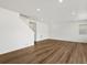 Bright living room with hardwood floors and recessed lighting illuminates a neutral interior at 553 Homestead Ave, Brighton, CO 80601