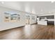 Open-concept with hard floors, recessed lighting, and access to the kitchen at 553 Homestead Ave, Brighton, CO 80601