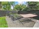 Enjoy relaxing in a hammock in this charming backyard with garden beds and privacy fence at 1690 Spruce St, Denver, CO 80220