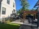 This backyard showcases a patio, outdoor seating, and a pergola, creating an ideal outdoor entertaining space at 1690 Spruce St, Denver, CO 80220
