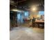 Unfinished basement with concrete floors and exposed utilities, providing potential for customization at 1690 Spruce St, Denver, CO 80220