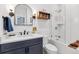 Bathroom with sleek vanity, modern fixtures, and tiled shower over tub with glass enclosure at 1690 Spruce St, Denver, CO 80220