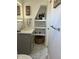 Bathroom vanity featuring marble floors, open shelving, and modern fixtures at 1690 Spruce St, Denver, CO 80220