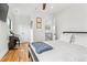 Bedroom with hardwood floors, ceiling fan, and natural light from window at 1690 Spruce St, Denver, CO 80220