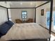 Well-appointed bedroom features a comfortable bed, window, and sitting area with dual armchairs at 1690 Spruce St, Denver, CO 80220