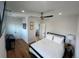 Bedroom features hardwood floors, ceiling fan, and contemporary decor at 1690 Spruce St, Denver, CO 80220