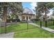 Charming home featuring a fenced yard, inviting front porch and an upper level balcony at 1690 Spruce St, Denver, CO 80220
