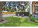 Front yard featuring a well manicured lawn and a seating area with two Adirondack chairs and gravel at 1690 Spruce St, Denver, CO 80220