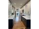 Modern kitchen featuring two-tone cabinetry, quartz countertops, and stainless steel appliances at 1690 Spruce St, Denver, CO 80220