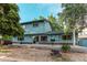 Large backyard with ample lawn, deck, and mature trees providing a perfect outdoor living and entertaining space at 11682 E Iowa Ave, Aurora, CO 80012
