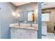 Modern bathroom with double vanity, granite countertop, and stylish fixtures at 11682 E Iowa Ave, Aurora, CO 80012