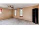 Bedroom with two windows and a large storage cabinet at 11682 E Iowa Ave, Aurora, CO 80012