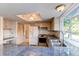 Cozy kitchen with stainless steel appliances, blue countertops, and natural light at 11682 E Iowa Ave, Aurora, CO 80012