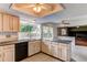 Open kitchen with granite countertops and view into the backyard at 11682 E Iowa Ave, Aurora, CO 80012