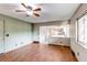 Open living space with an entrance to the kitchen and door to the outside at 11682 E Iowa Ave, Aurora, CO 80012