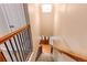View of the staircase from above, showing the light-filled entryway at 11682 E Iowa Ave, Aurora, CO 80012