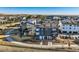 Aerial view of modern townhouses with solar panels, walkways, landscaping, and a neighborhood location at 2446 W 167Th Ln, Broomfield, CO 80023