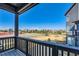 Balcony view overlooking community area with sports field and common green space, providing a relaxing outdoor retreat at 2446 W 167Th Ln, Broomfield, CO 80023