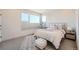 Bright bedroom featuring large windows, neutral décor, and comfortable furnishings, creating a relaxing and inviting retreat at 2446 W 167Th Ln, Broomfield, CO 80023