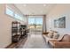 Bright bedroom with a modern-styled workstation, light wood floors, and plenty of natural light at 2446 W 167Th Ln, Broomfield, CO 80023