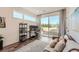 Bright bedroom with a modern-styled workstation, light wood floors, and plenty of natural light at 2446 W 167Th Ln, Broomfield, CO 80023
