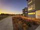 Charming townhome exterior with a landscaped walkway, perfect for evening strolls at 2446 W 167Th Ln, Broomfield, CO 80023