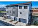 Modern townhome exterior showcasing gray siding and attached garage at 2446 W 167Th Ln, Broomfield, CO 80023