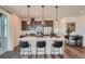Modern kitchen with stainless steel appliances, stylish pendant lighting, and bar seating at 2446 W 167Th Ln, Broomfield, CO 80023